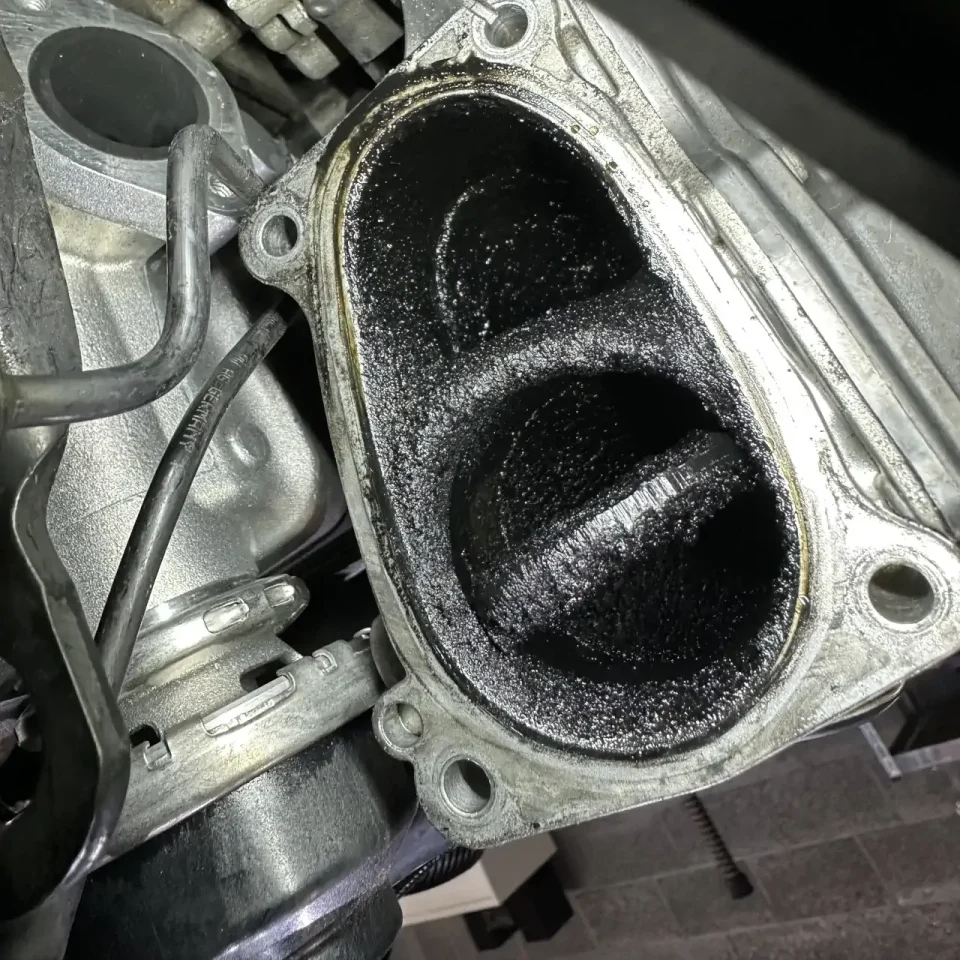 Dirty engine component during walnut blasting